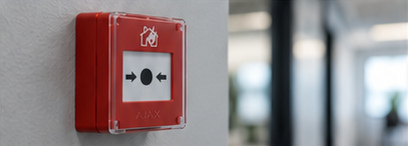 Red Ajax manual call point with clear protective cover, from the approved artwork